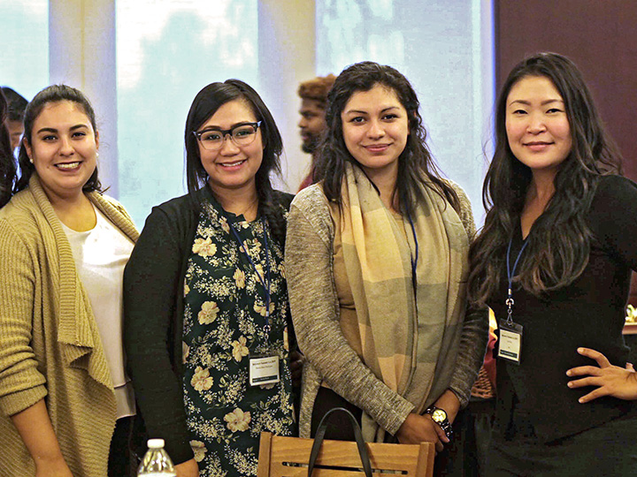 four women at a professional development event
