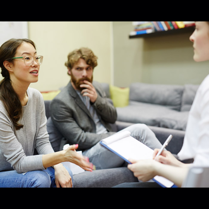 three people in a counseling session