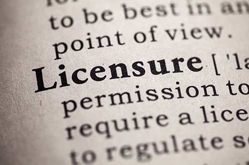 close up shot of dictionary with definition of licensure